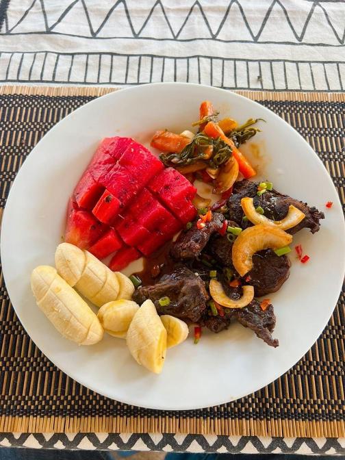 Rib eye steak with roasted cashews, vegetables, watermelon, and bananas at Vonfidel Ranch