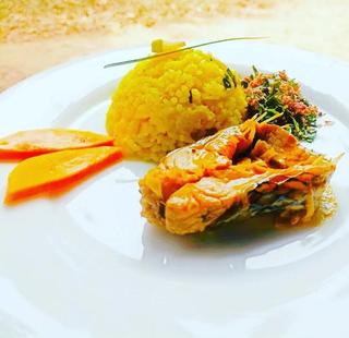 Fish served with tropical rice, mango, and herbs at Vonfidel Ranch