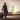 A man with a suitcase leaves