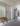 Modern minimalist entryway with wooden bench and full-length mirror