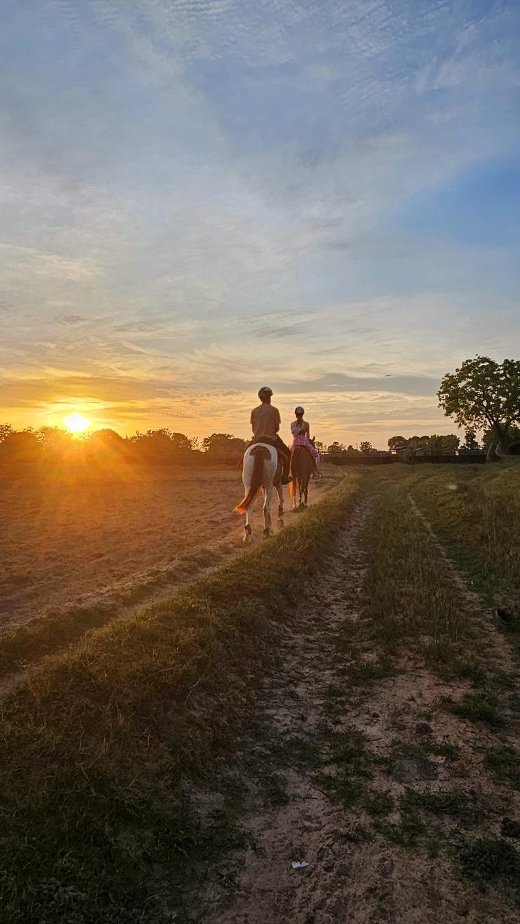 Riders moving quietly at sunset during a Vonfidel Ranch riding holiday in Sri Lanka